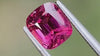 Intense pink natural spinel gemstone, cushion cut, under natural light, ideal for custom fine jewellery pieces. High-quality gemstone from Mogok, Myanmar. 