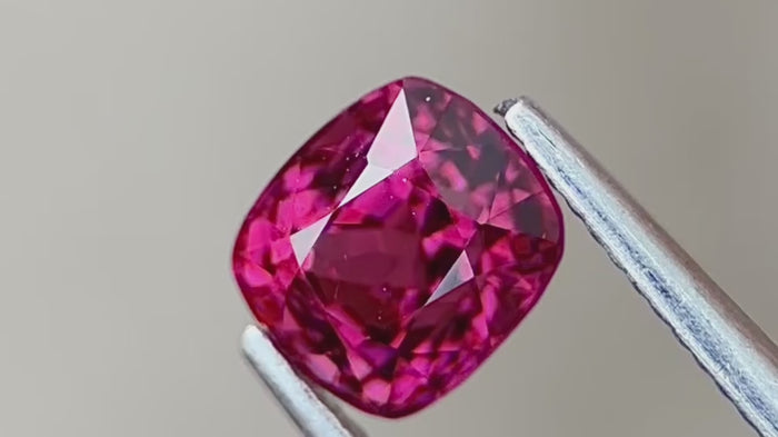 Deep pink spinel with top clarity, demonstrating its vivid hue and natural sparkle under various lighting. Sourced directly from Myanmar, ensuring authenticity and durability.