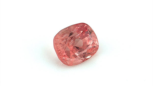 Hand-cut natural spinel in a unique pink-orange shade, sourced ethically from Mogok, Burma.
